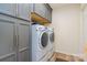 Laundry room with washer, dryer, and plenty of storage at 612 Spencer Ln, Kannapolis, NC 28081