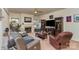 Spacious living room with fireplace, two recliners, and a large TV at 612 Spencer Ln, Kannapolis, NC 28081