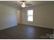 Bright bedroom with wood-look floors, ceiling fan, and ample natural light at 6524 Athens Ln, York, SC 29745