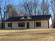 White house with black roof and trim, covered front porch, and large backyard at 6524 Athens Ln, York, SC 29745