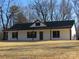 White house with black roof and trim, covered front porch, and large backyard at 6524 Athens Ln, York, SC 29745