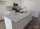 Kitchen island with granite countertop and stainless steel sink at 6524 Athens Ln, York, SC 29745