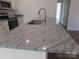 Kitchen island with granite countertop and stainless steel sink at 6524 Athens Ln, York, SC 29745