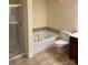 Bathroom featuring a separate shower and soaking tub at 6605 Central Pacific Ave, Charlotte, NC 28210