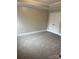 Bedroom featuring neutral carpet, and a double door closet at 6605 Central Pacific Ave, Charlotte, NC 28210