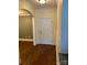 Entryway featuring hardwood floors with an archway and a white door at 6605 Central Pacific Ave, Charlotte, NC 28210