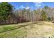 Large backyard with wooden pergola and fenced yard at 7757 St Andrews Ln, Stanley, NC 28164