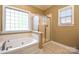 Bathroom features a soaking tub and a separate shower at 7757 St Andrews Ln, Stanley, NC 28164