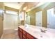 Bathroom with double vanity, tub shower combo, and tile flooring at 7757 St Andrews Ln, Stanley, NC 28164