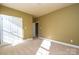 Bedroom with carpet flooring, neutral walls and access to another room at 7757 St Andrews Ln, Stanley, NC 28164