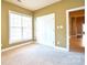 Spacious bedroom with double doors and neutral decor at 7757 St Andrews Ln, Stanley, NC 28164