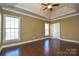 Bedroom with hardwood floors and neutral colored walls at 7757 St Andrews Ln, Stanley, NC 28164