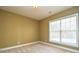 Bright bedroom with neutral walls, carpet, and window blinds at 7757 St Andrews Ln, Stanley, NC 28164