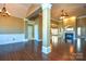 Open dining area with hardwood floors and chandelier at 7757 St Andrews Ln, Stanley, NC 28164