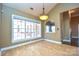 Bright dining area with hardwood floors and large windows at 7757 St Andrews Ln, Stanley, NC 28164