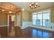 Bright dining room with hardwood floors and chandelier at 7757 St Andrews Ln, Stanley, NC 28164