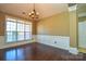 Formal dining room with hardwood floors and wainscoting at 7757 St Andrews Ln, Stanley, NC 28164