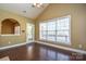 Spacious dining area with hardwood floors and access to deck at 7757 St Andrews Ln, Stanley, NC 28164