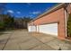 Brick house with attached garage and driveway at 7757 St Andrews Ln, Stanley, NC 28164