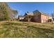 Brick house exterior with deck and backyard at 7757 St Andrews Ln, Stanley, NC 28164