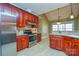 Stainless steel appliances and ample wood cabinets in kitchen at 7757 St Andrews Ln, Stanley, NC 28164