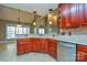 Island kitchen with granite countertops and custom cabinetry at 7757 St Andrews Ln, Stanley, NC 28164