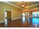 Open floor plan with hardwood floors and high ceilings at 7757 St Andrews Ln, Stanley, NC 28164