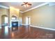 Living room with hardwood floors and gas fireplace at 7757 St Andrews Ln, Stanley, NC 28164