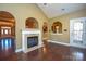 Living room with hardwood floors and gas fireplace at 7757 St Andrews Ln, Stanley, NC 28164