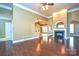 Spacious living room with hardwood floors and fireplace at 7757 St Andrews Ln, Stanley, NC 28164