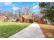 Aerial view showcasing a charming house and its surrounding landscape at 8149 Mattingridge Dr, Charlotte, NC 28270