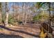 Sunny backyard with seating and wooden fence at 8149 Mattingridge Dr, Charlotte, NC 28270