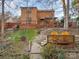 House's backyard with stone path and deck at 8149 Mattingridge Dr, Charlotte, NC 28270