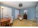 Bedroom with a desk, chair, and vintage radio at 8149 Mattingridge Dr, Charlotte, NC 28270