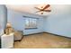 Light blue bedroom with carpeted floor and a window at 8149 Mattingridge Dr, Charlotte, NC 28270