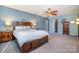 Main bedroom with dark wood furniture and access to a balcony at 8149 Mattingridge Dr, Charlotte, NC 28270