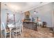 Open dining area with a view of the living room and fireplace at 8149 Mattingridge Dr, Charlotte, NC 28270