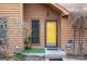 Close-up of the front entrance with a yellow door and landscaping at 8149 Mattingridge Dr, Charlotte, NC 28270