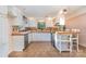 Galley style kitchen with white cabinets and tile flooring at 8149 Mattingridge Dr, Charlotte, NC 28270