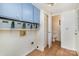 Functional laundry room with upper cabinets and a closet at 8149 Mattingridge Dr, Charlotte, NC 28270