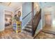 Wood staircase leading to the second floor with wood flooring at 8149 Mattingridge Dr, Charlotte, NC 28270