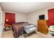 Neutral-toned bedroom featuring a baby bassinet, and dark brown patterned bedding at 939 Malotte Ln, Gastonia, NC 28054