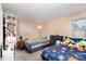 Shared bedroom featuring carpet, neutral walls, and two beds, one with galaxy themed bedding at 939 Malotte Ln, Gastonia, NC 28054