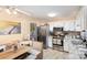 Kitchen with stainless steel appliances and bench style dining area at 939 Malotte Ln, Gastonia, NC 28054