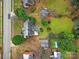 Aerial view of a house and large backyard, detached garage, and neighboring properties at 951 Cedar St, Rock Hill, SC 29730