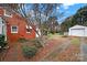 Brick home with detached garage and driveway at 951 Cedar St, Rock Hill, SC 29730