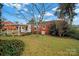 Brick home with covered patio and expansive lawn at 951 Cedar St, Rock Hill, SC 29730