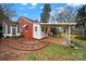 Brick home with covered patio and landscaping at 951 Cedar St, Rock Hill, SC 29730