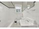 Classic bathroom with white tile and black floor at 951 Cedar St, Rock Hill, SC 29730