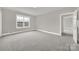 Spacious bedroom with carpet and large window at 951 Cedar St, Rock Hill, SC 29730